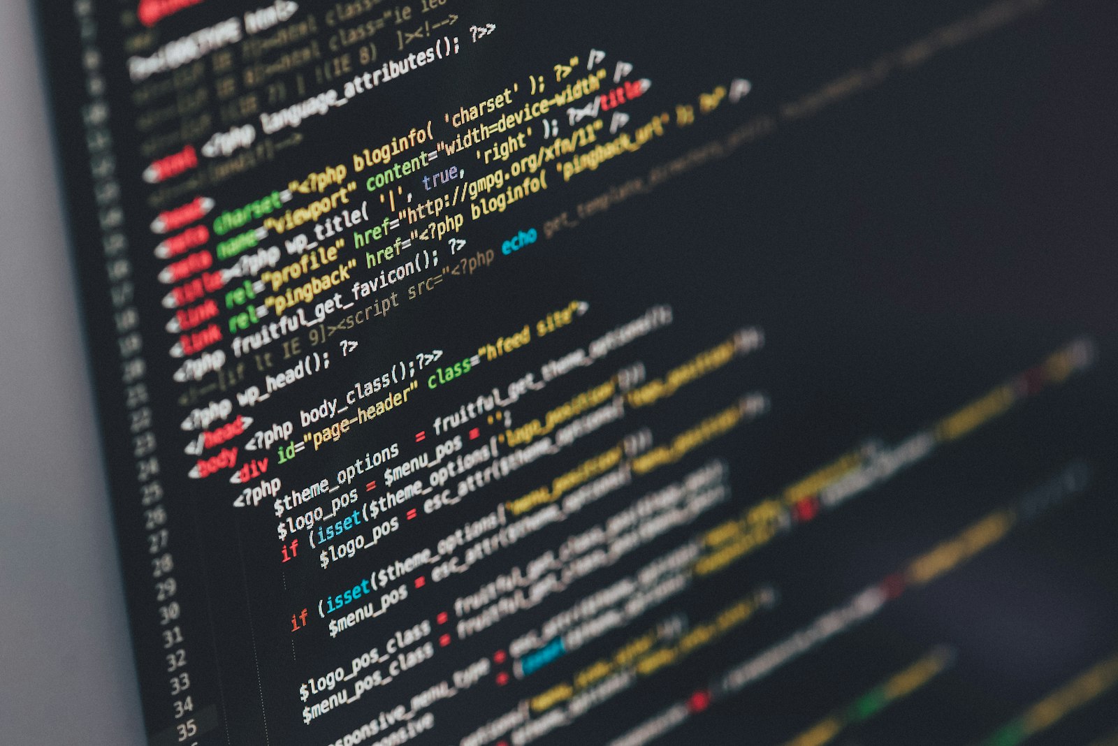 Lines of program code on a dark computer screen
