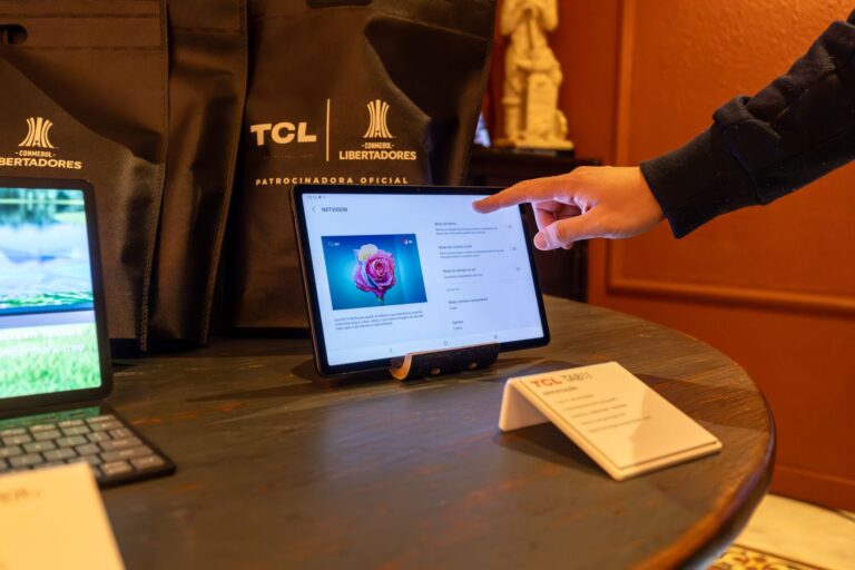 Solo founder walking a prospect through an interactive product demo on a laptop