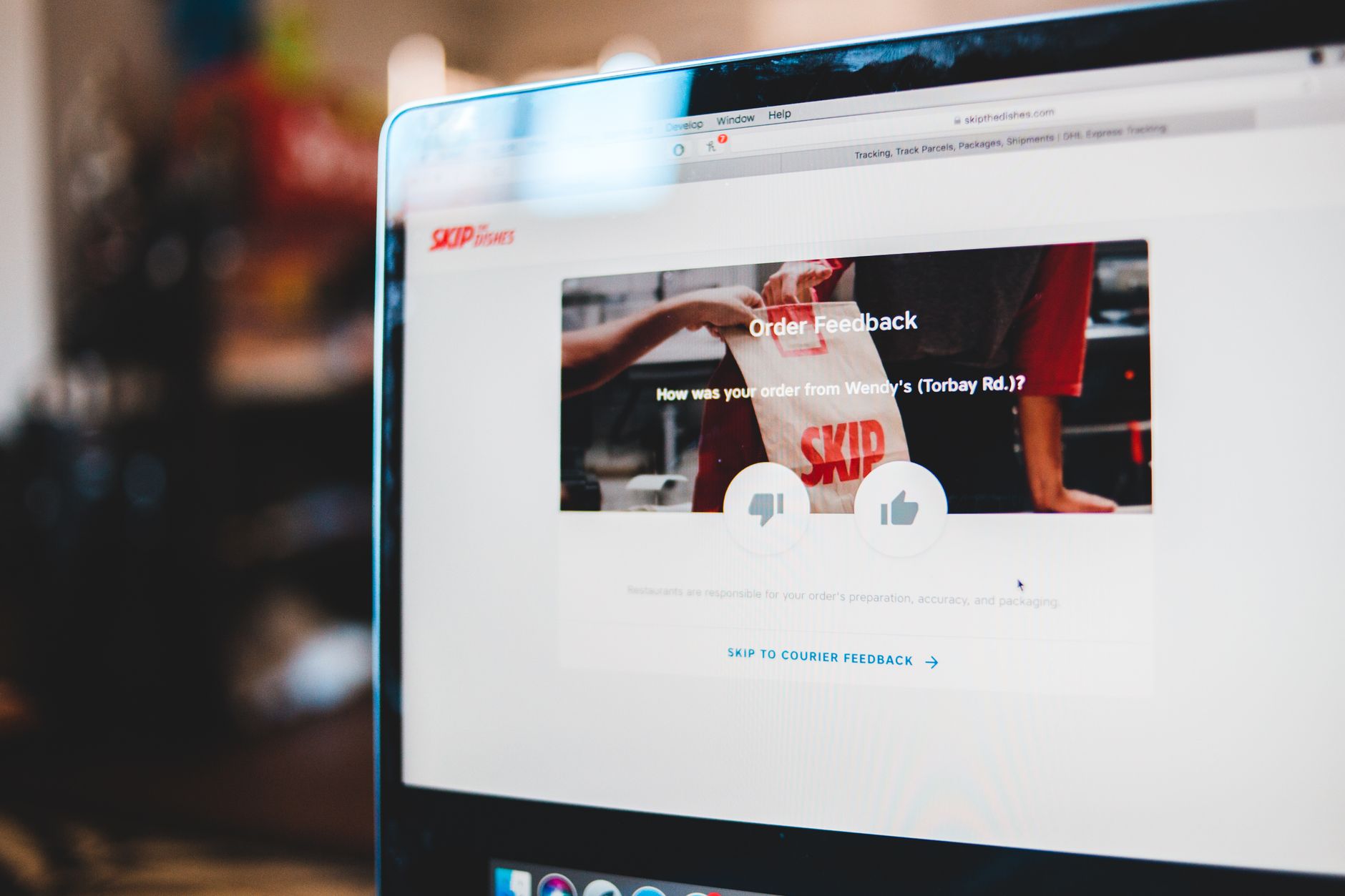 Solo founder reading customer testimonials and star ratings on a laptop