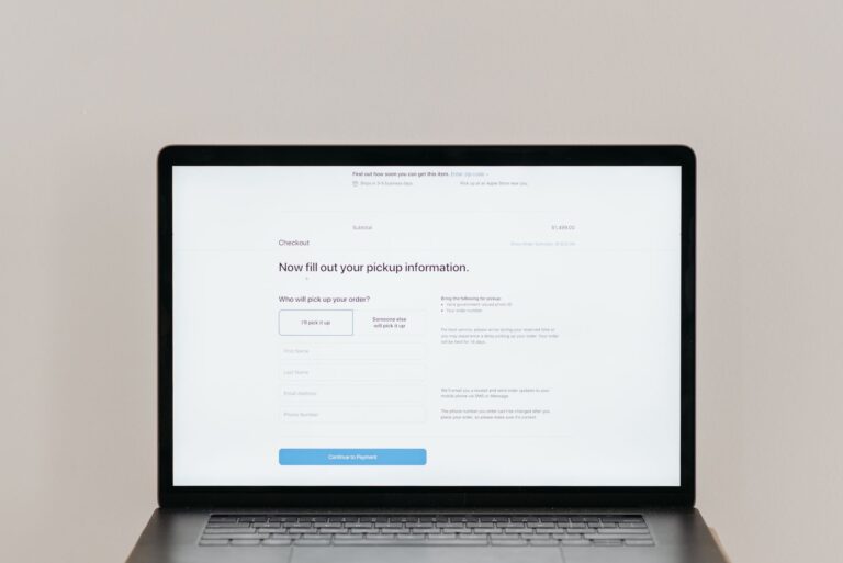 Laptop displaying an online checkout form used to compare ThriveCart, SamCart and Payhip